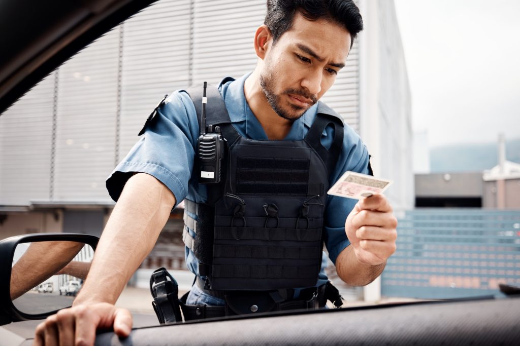 Stop, drivers license or police officer in city to check info for law enforcement, protection or st